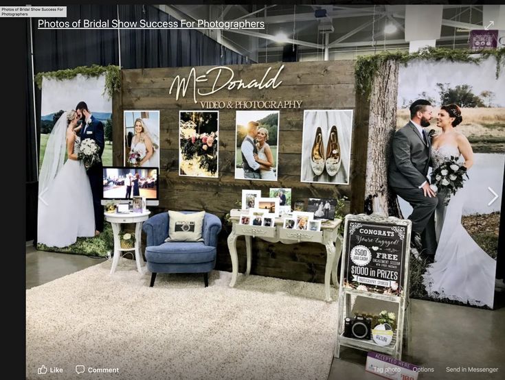 a man and woman standing next to each other in front of a booth at a wedding show