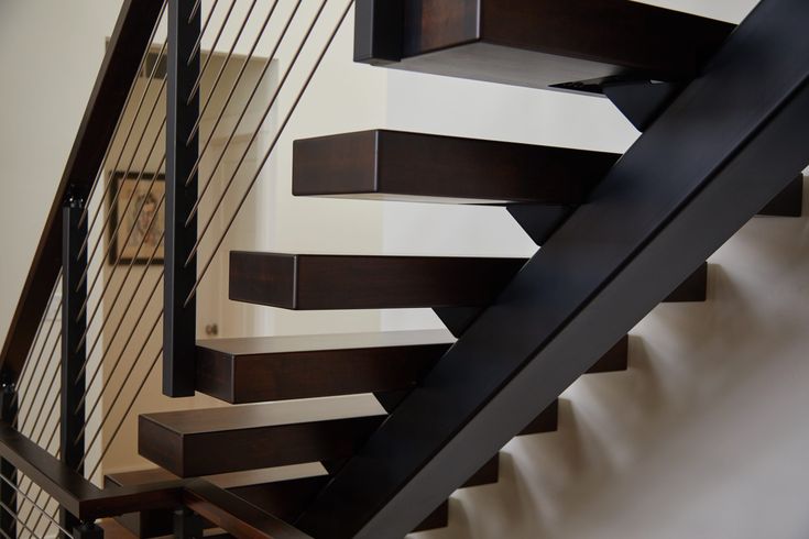 the stair railings are made of wood and metal