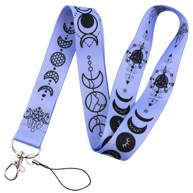 a lanyard with an image of the moon and stars on it