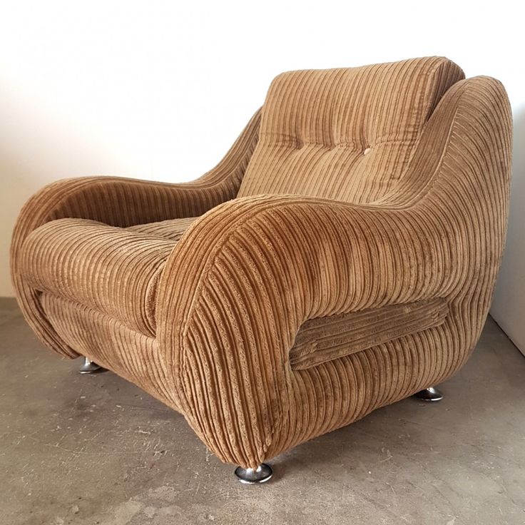 a brown chair sitting on top of a cement floor