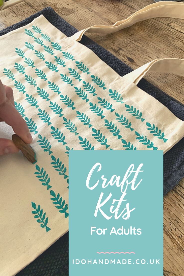 a person is using a craft kit to make a bag with leaves on it and the words craft kits for adults