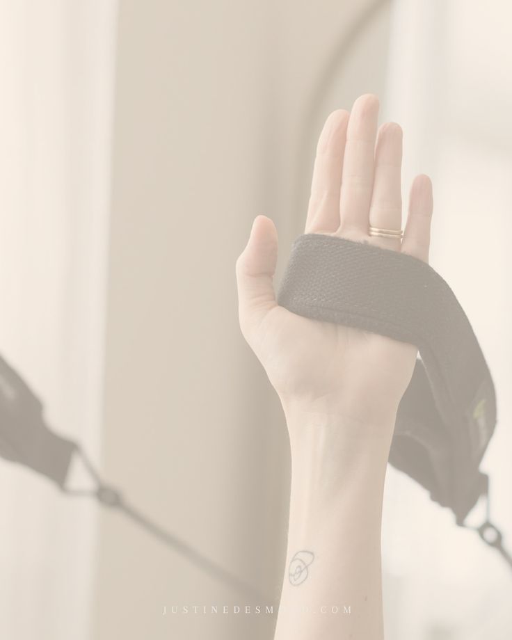 a woman's hand with a wrist band on it