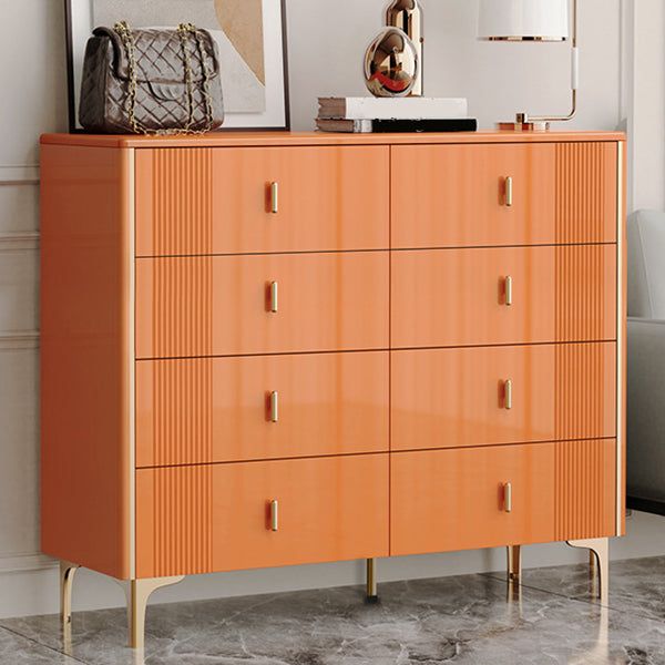 an orange chest of drawers in a room