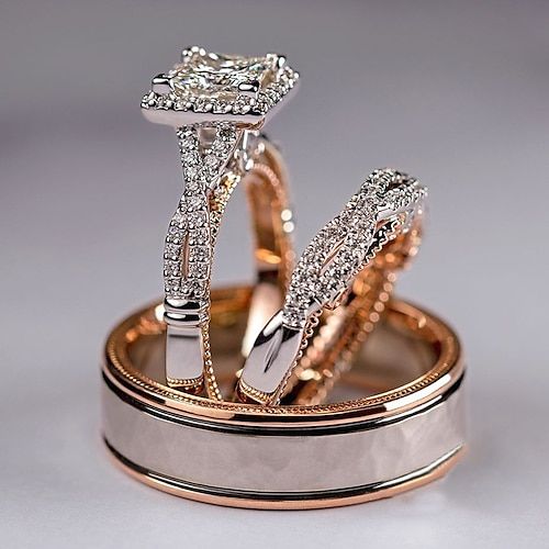 two wedding rings with diamonds on top of each other in gold and silver ring sets