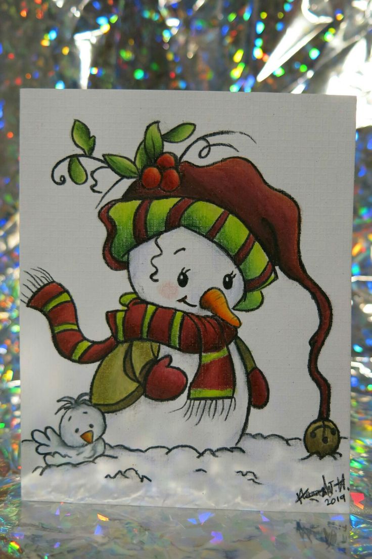 a snowman with a hat and scarf on