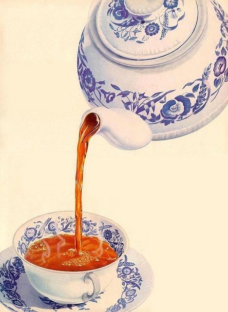 a teapot pouring orange liquid into a white bowl filled with soup on top of a blue and white plate