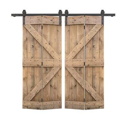 two wooden doors with metal bars on them