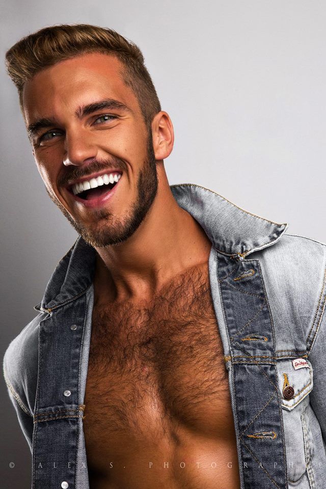 a shirtless man with no shirt on smiling