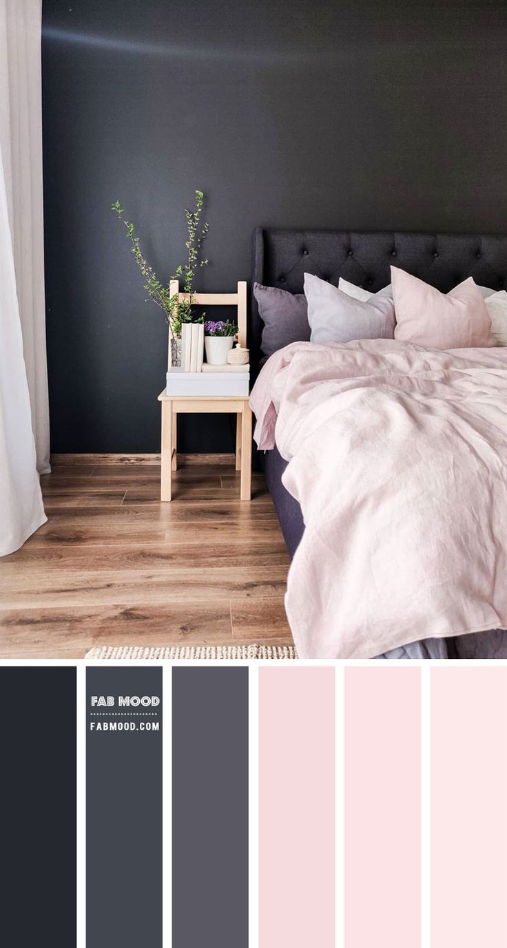 a bedroom with black walls, white curtains and pink bedding in shades of grey