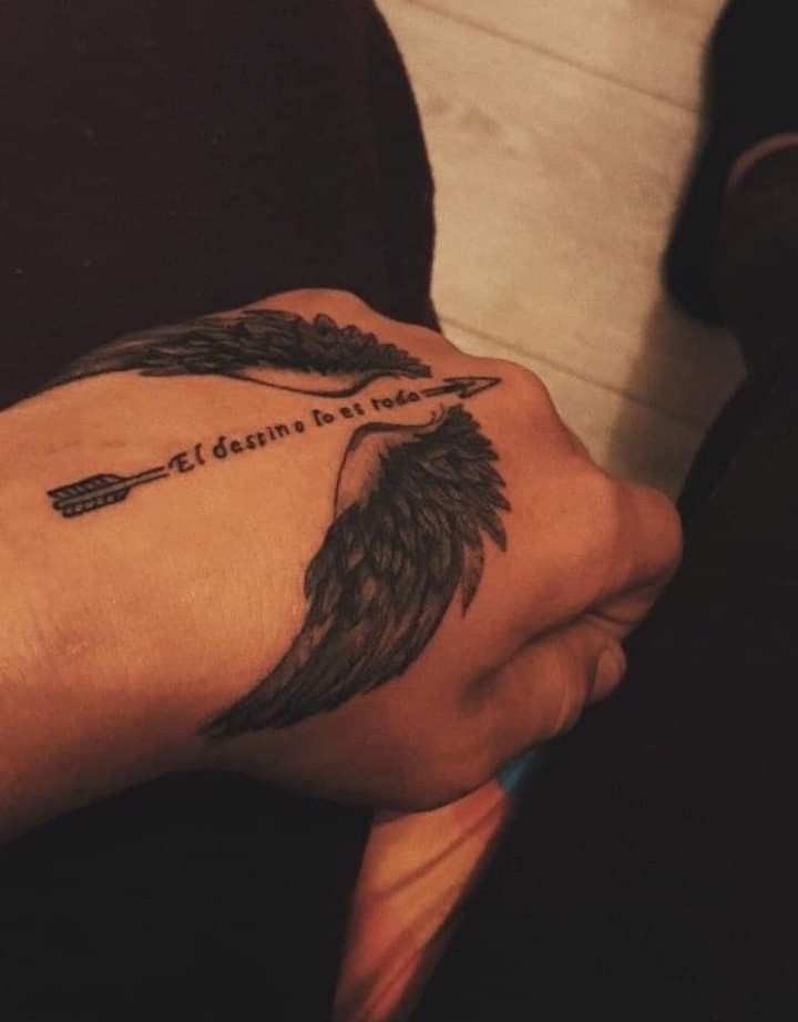 a person's arm with a tattoo on it that reads, let dreams be told