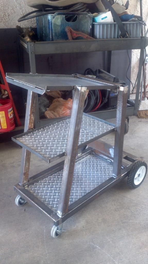 there is a small metal cart with wheels