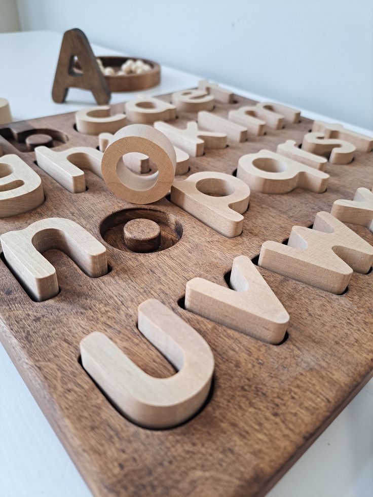 wooden letters and numbers are arranged on a table