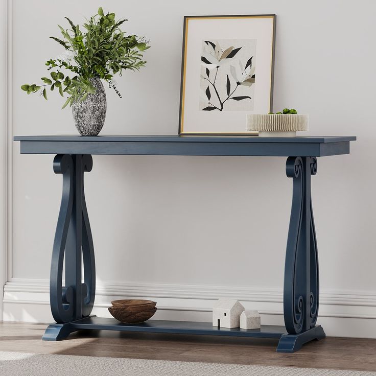 a blue console table with a plant on top