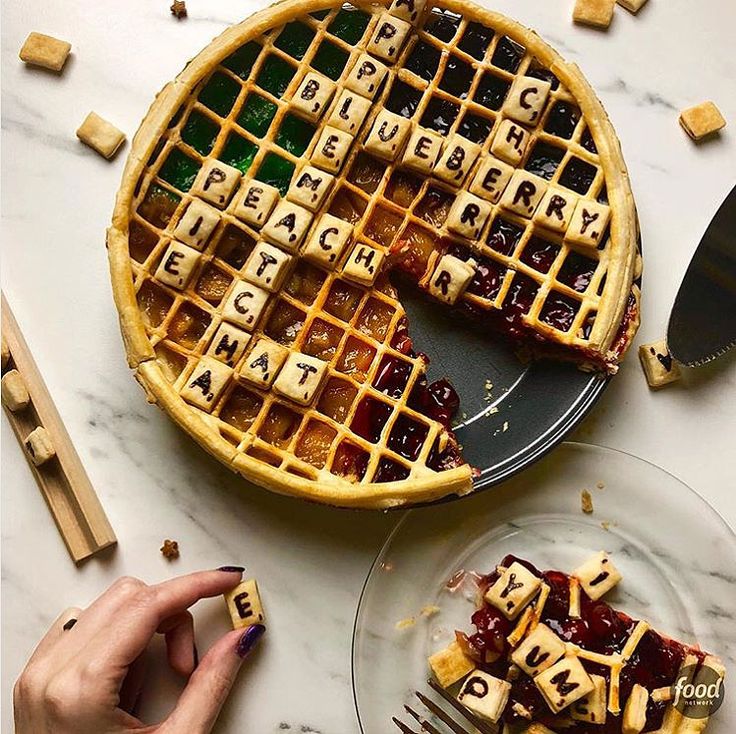 a waffle with letters spelling out the word love on it and someone holding a fork