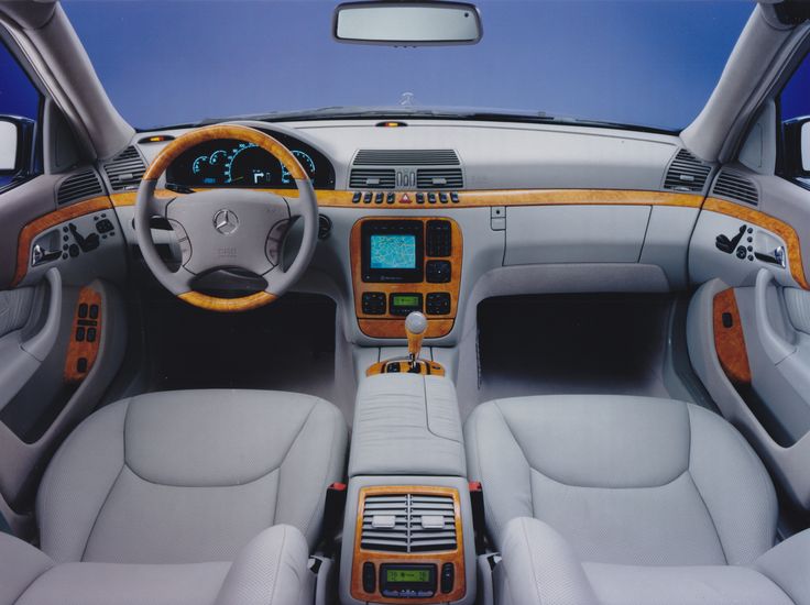 an interior view of a car with dashboard and steering wheel