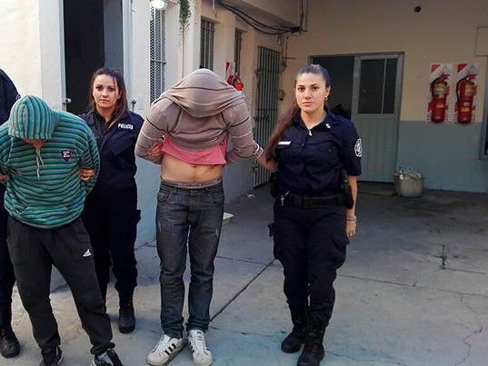 Empowered Female Police Officers Arresting Two Suspects