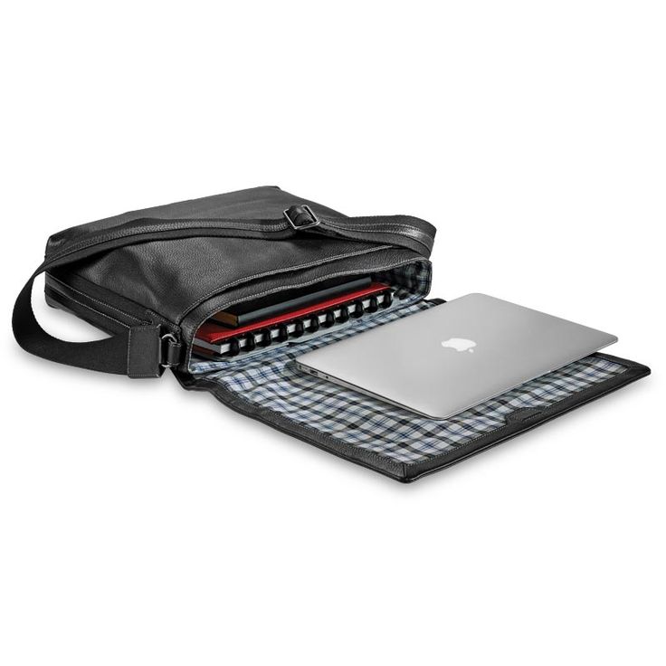 an open laptop computer sitting on top of a black bag