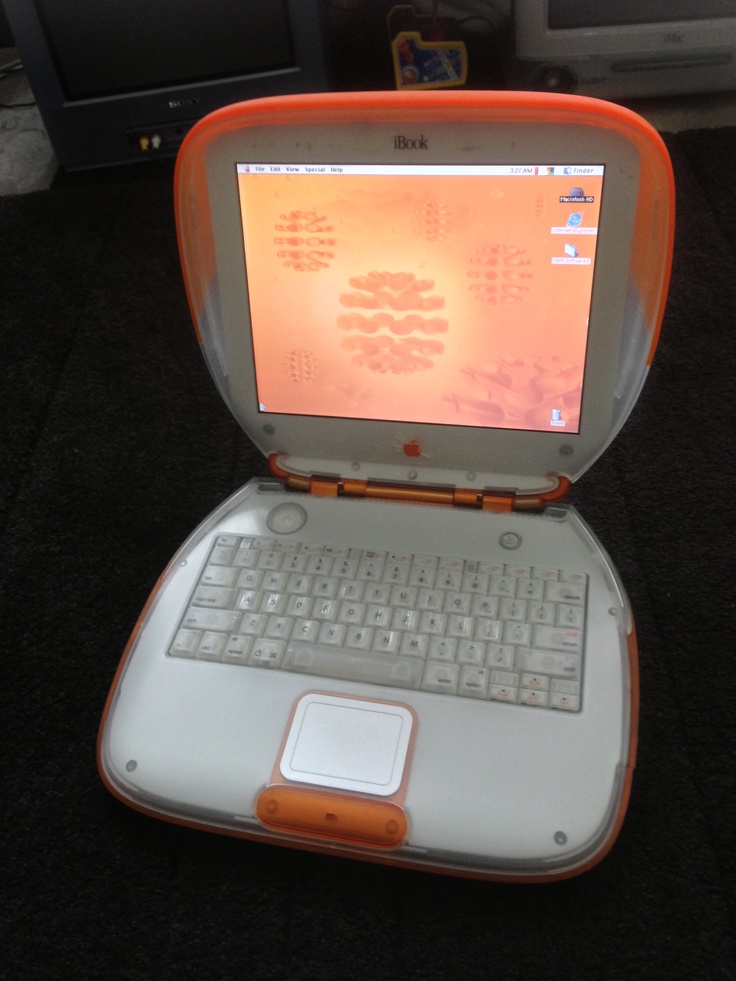 an open laptop computer sitting on top of a table