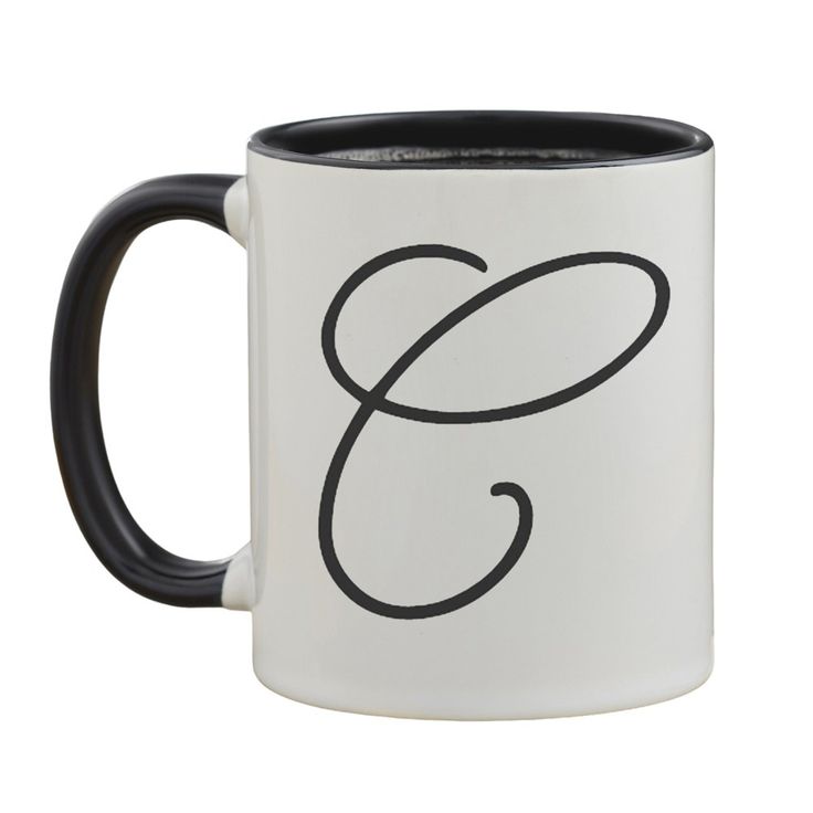 a black and white coffee mug with the letter g on it