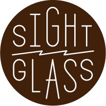 a brown and white logo with the words sight glass on it's bottom half