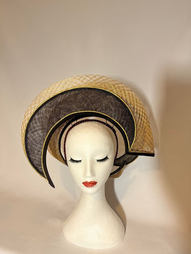 Hat Title : Crowning Glory in Black and Gold  One of a kind piece of couture millinery in black and gold, where the front and back are designed differently, providing a different view from each angle.  Goes on your head via a custom designed headband. It can be made in other colours. Check out the leopard and red in my shop, as an example. Fitted Black Headpiece For Races, Fitted Black Sinamay Hat, Black Fitted Sinamay Hat, Fitted Black Headpiece For Royal Ascot, Black Fitted Fascinator With Structured Crown, Gold Costume Hats With Structured Crown For Evening, Fitted Black Hat For Royal Ascot, Fitted Black Costume Hat For Royal Ascot, Fitted Gold Fascinator With Curved Brim