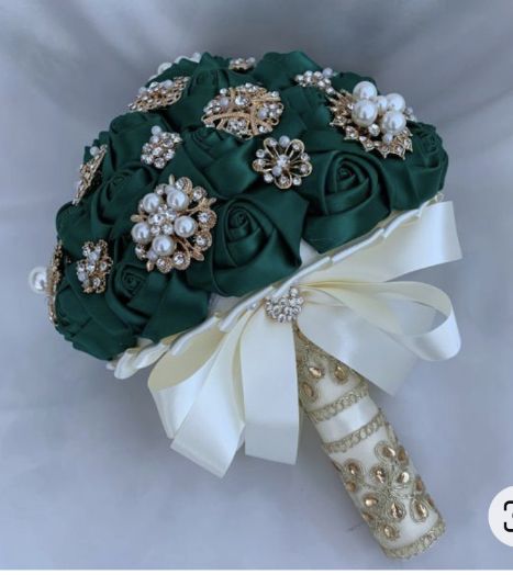 a bridal bouquet with green roses and pearls