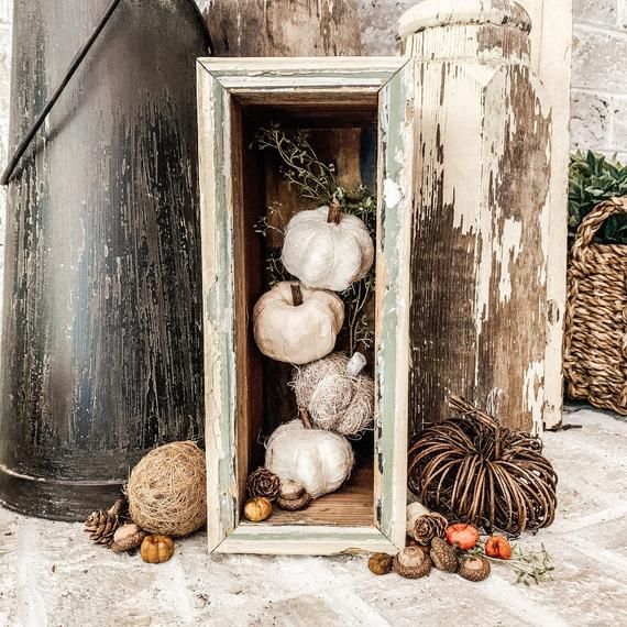 an old wooden box filled with cotton balls