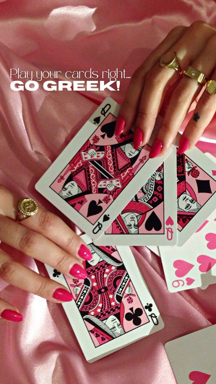 a woman's hands holding four playing cards with the words, play your cards right go greek