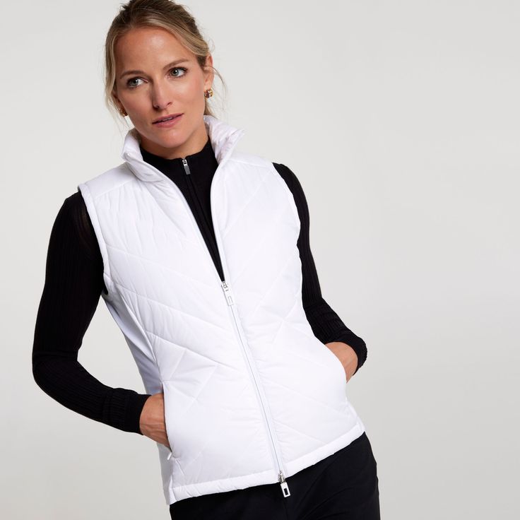 Fall’s changeable weather means that sometimes you don’t need a full coat. Enter CALIA, with a new vest that’s both golf and city ready. The lightweight construction holds down insulation that warms your core without poking through the surface. On top of that, the water repellent fabric makes light rain bead and slide right off. Fit & Design: Regular fit vest Stand collar with full center front zip The front zip pockets securely hold your essentials Technology: Downproof fabric keeps feathers fr Golf Vest, White Puffer Vest, Womens Athletic Outfits, Comfort Design, Water Repellent Fabric, Athletic Outfits, How To Make Light, Golf Outfit, Womens Vest