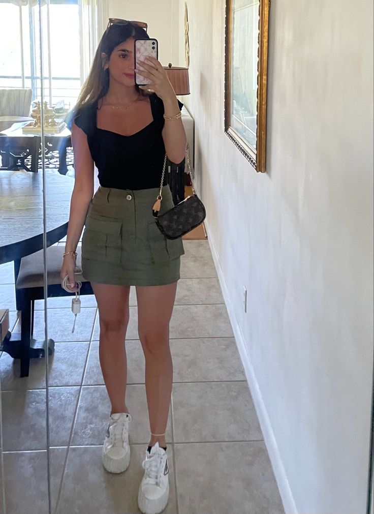 Outfits With A Green Skirt, Green Skirt And Black Top Outfit, Green And Black Skirt Outfits, Skirt Outfits Cargo, Green Skirt Black Top, Outfit Ideas With Green Skirt, What To Wear With Cargo Skirt, Outfits With Green Cargo Skirt, Cargo Skirt Green Outfit