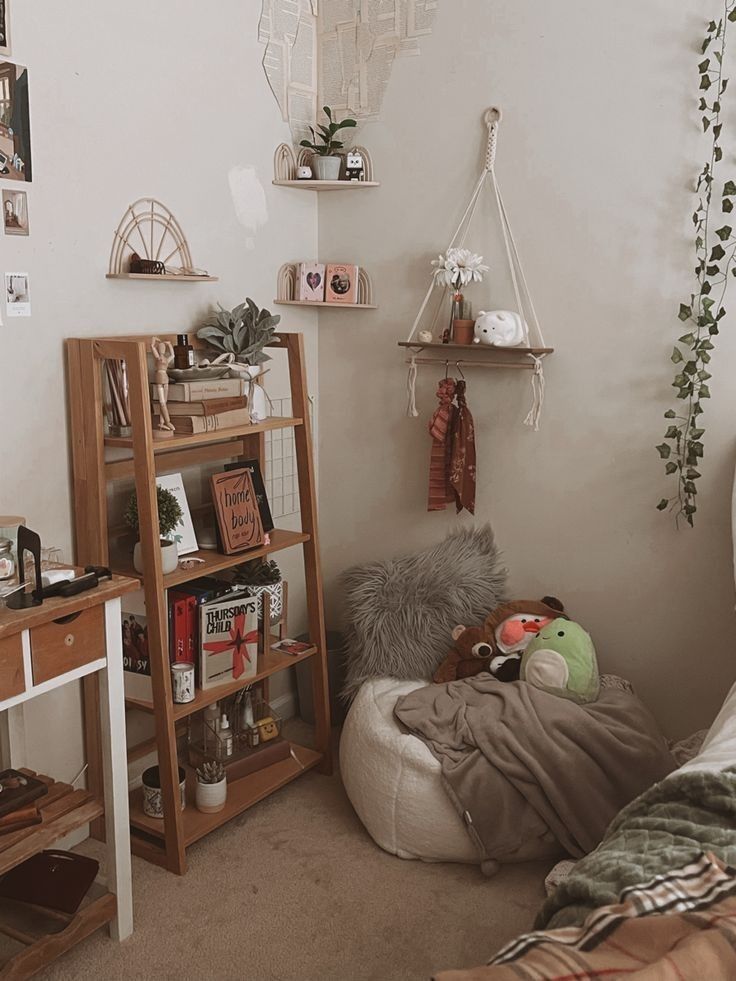 a bedroom with a bed, desk and shelves on the wall