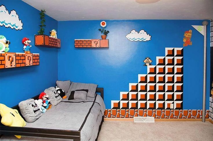 a bedroom decorated in mario bros theme with blue walls