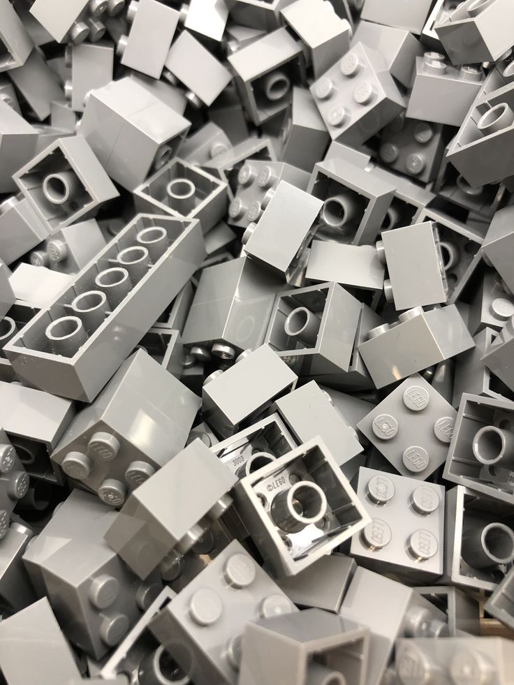 a pile of grey legos sitting on top of each other