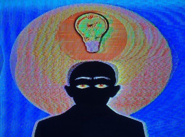 a man with a light bulb above his head on top of him, in front of a blue background