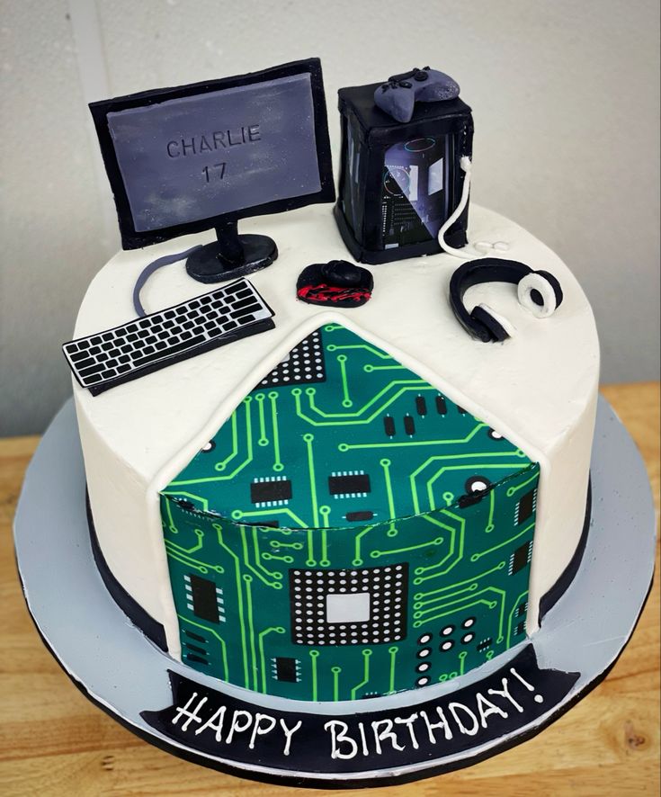 a computer themed birthday cake on a table