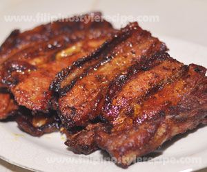 some meat is sitting on a white plate and ready to be eaten by someone else