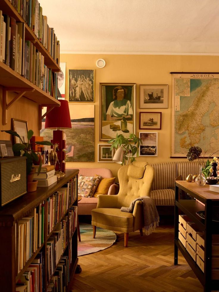 a living room filled with furniture and lots of books