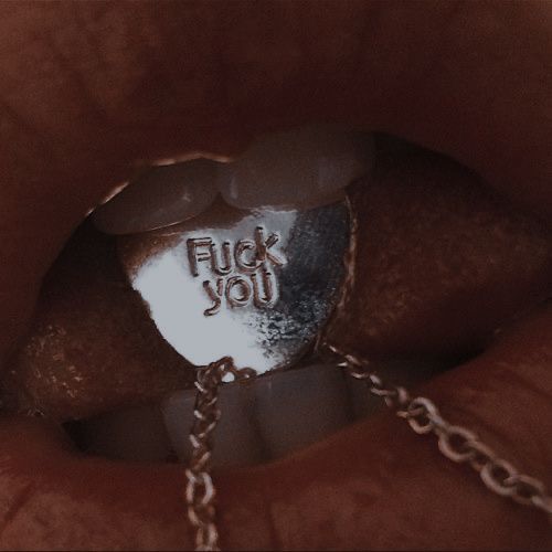 a close up of a person's mouth with a chain around it and the word flud you on it