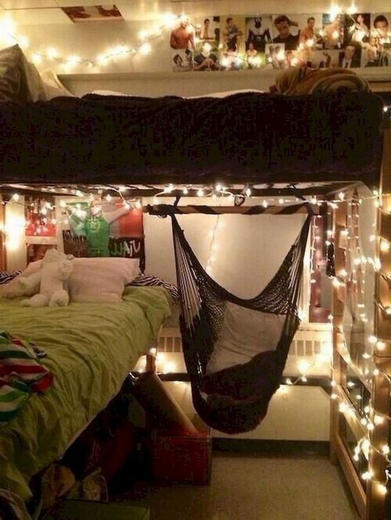 a bed with a hammock hanging from the ceiling