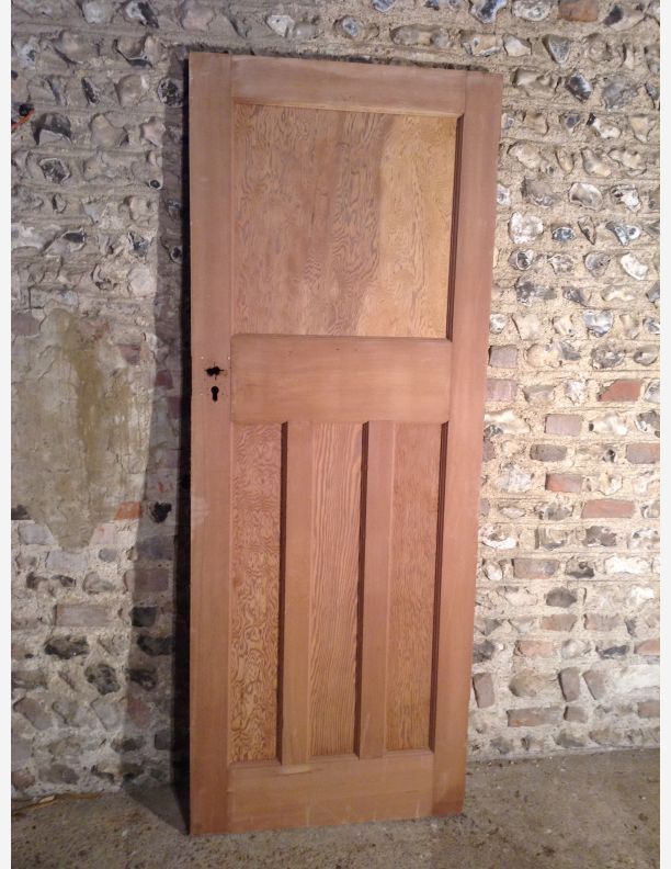 a wooden door in front of a brick wall with stone bricks on the walls and floor