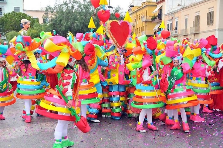 a group of people dressed in brightly colored costumes