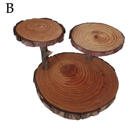 three pieces of wood sitting on top of each other in the shape of rings and circles