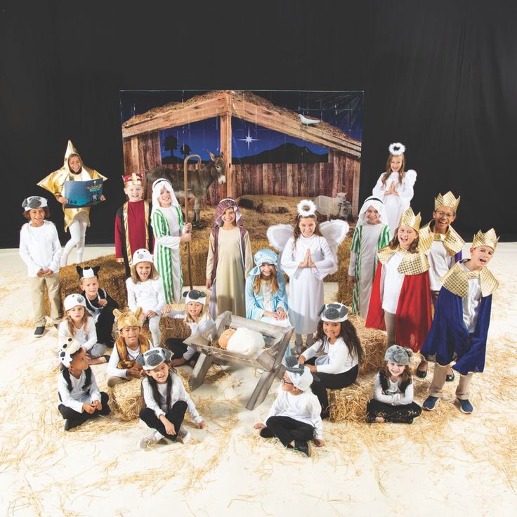 a group of children dressed up in nativity costumes