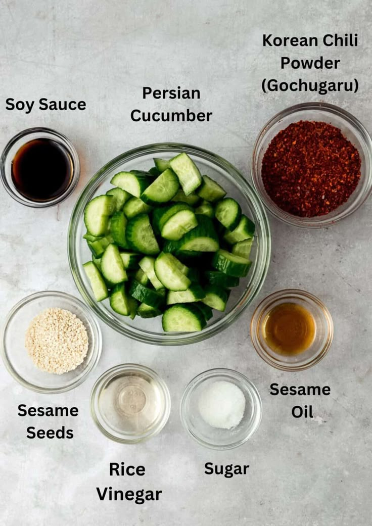 the ingredients for cucumber seasoning in bowls