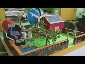 a model of a house with solar panels on the roof and trees in the yard