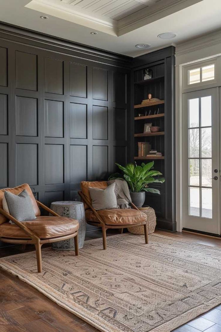 a living room with two chairs and a rug