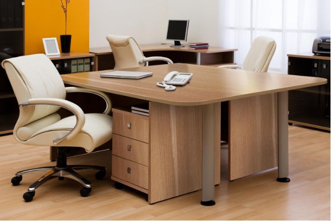 an office desk with two chairs and a laptop on it