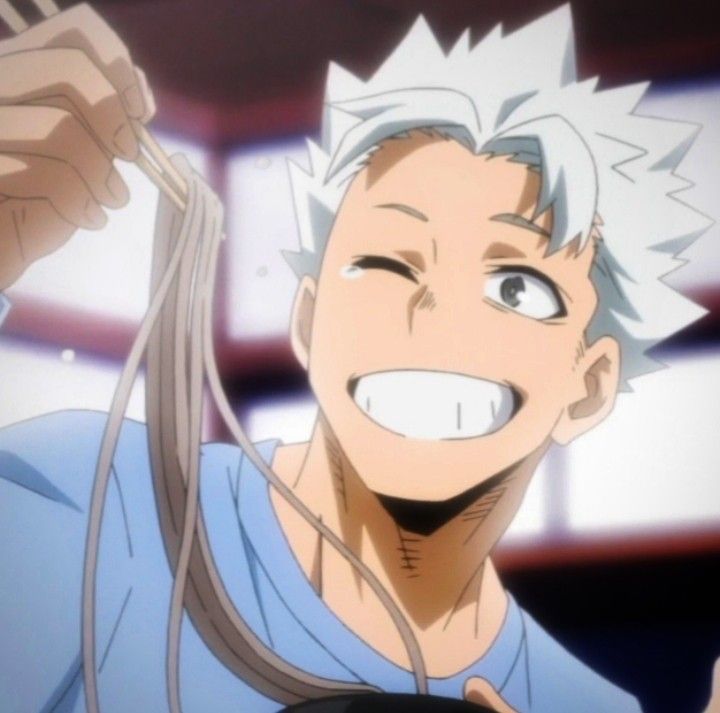 an anime character is smiling and holding something in his hand