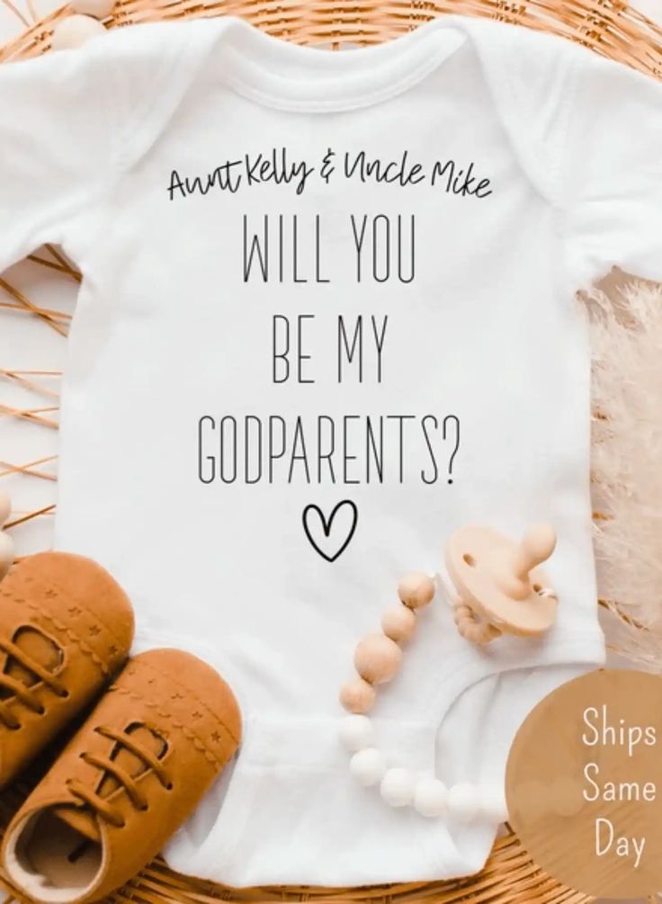 a white shirt with the words will you be my godparents? on it