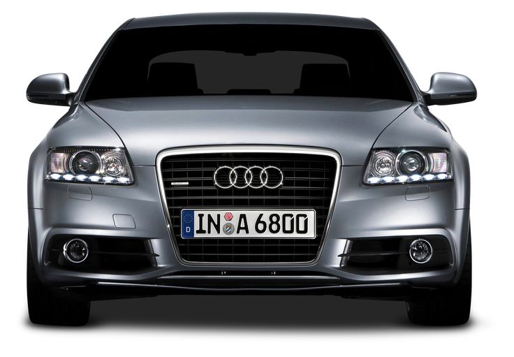 the front view of an audi car with its lights on and license plate in silver